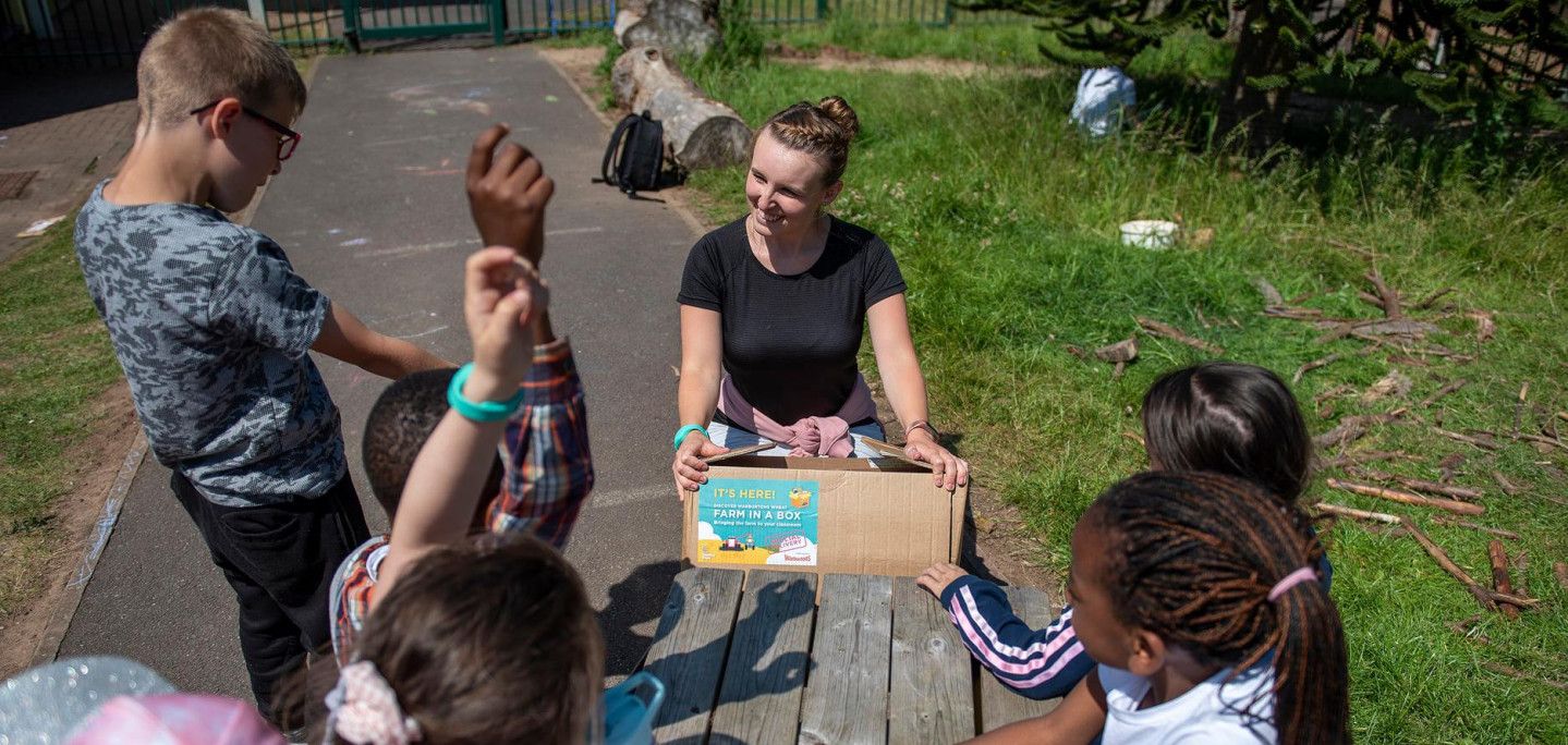 Teacher delivering Farm in a Box in a school