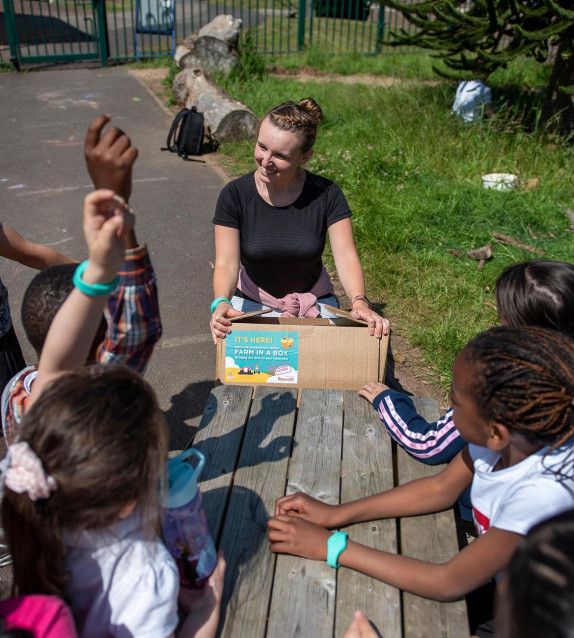 Teacher delivering Farm in a Box in a school