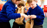 children explore the 'feely bags' from Farm in a Box