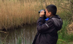 Boy looking through binoculars